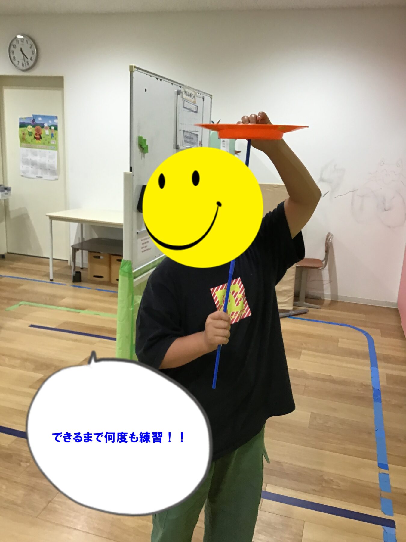 Child in a gym holds an orange frisbee on a blue rod above their head, mid-throw practice.