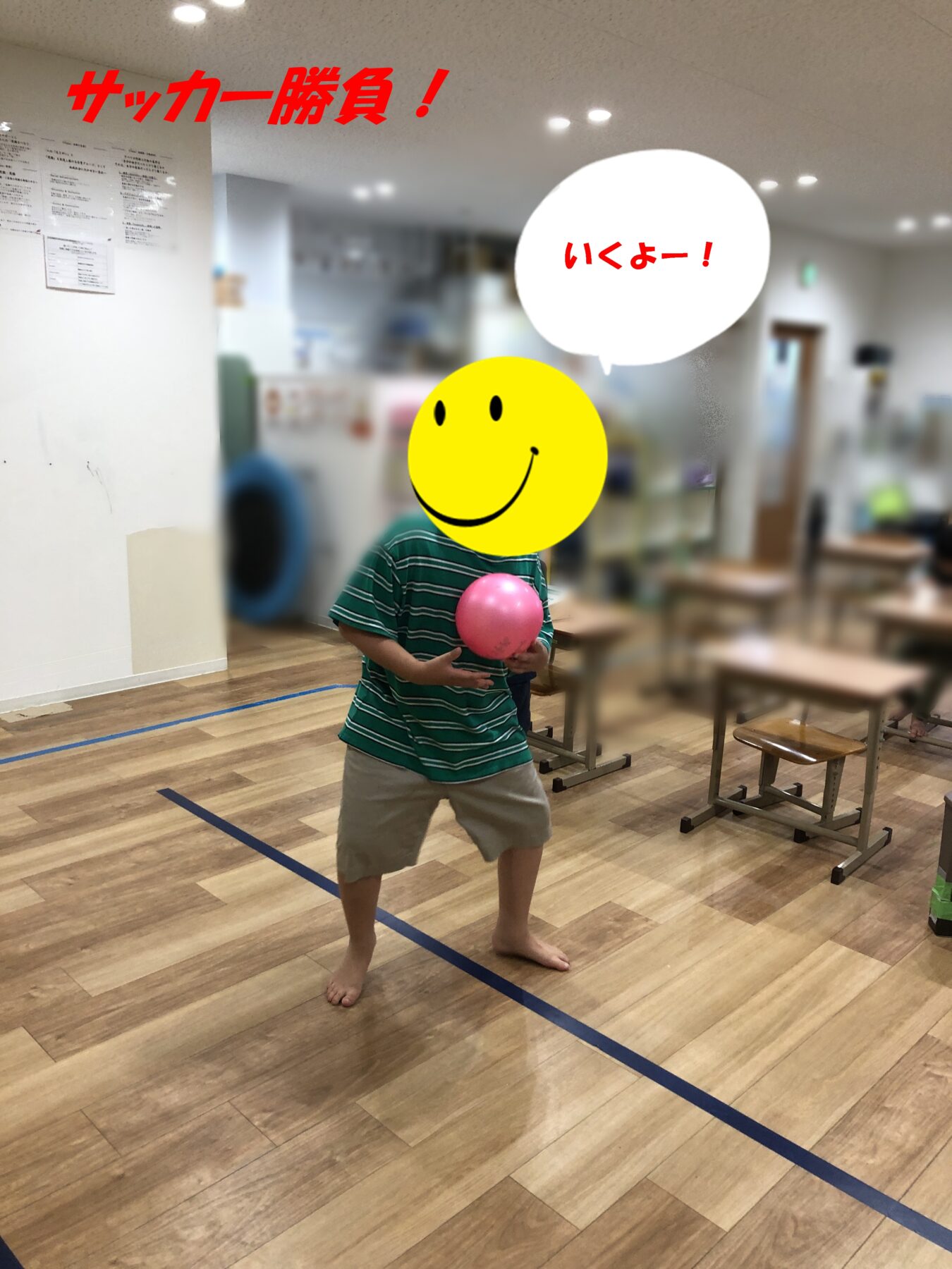 In a gym, a child holds a pink ball, with a big yellow smiley face overlaid and a red headline reading 'Soccer showdown!' plus a speech bubble that says 'Here I go!'