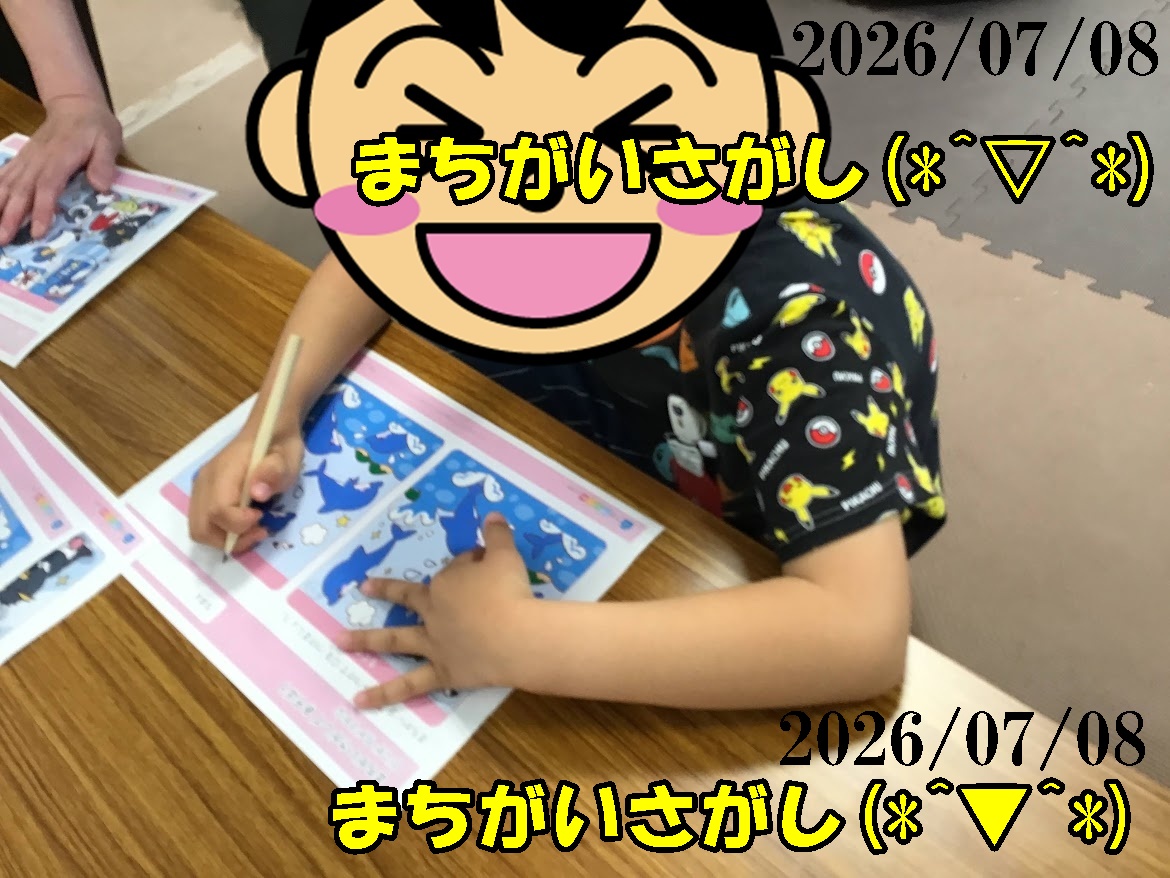 Child coloring blue worksheets at a wooden table; face is covered by a large laughing emoji, pencil in hand; date 2026/07/08 overlaid.