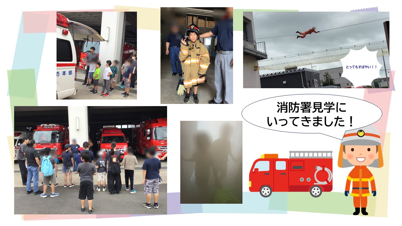 Group of children on a fire station tour watching red fire engines arrive in a garage, with firefighters guiding them.