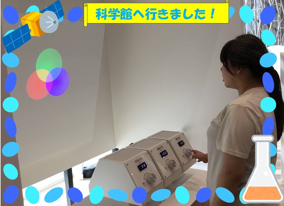 A person in a light-colored shirt adjusts knobs on a three-slot control panel with digital readouts in a science museum exhibit.