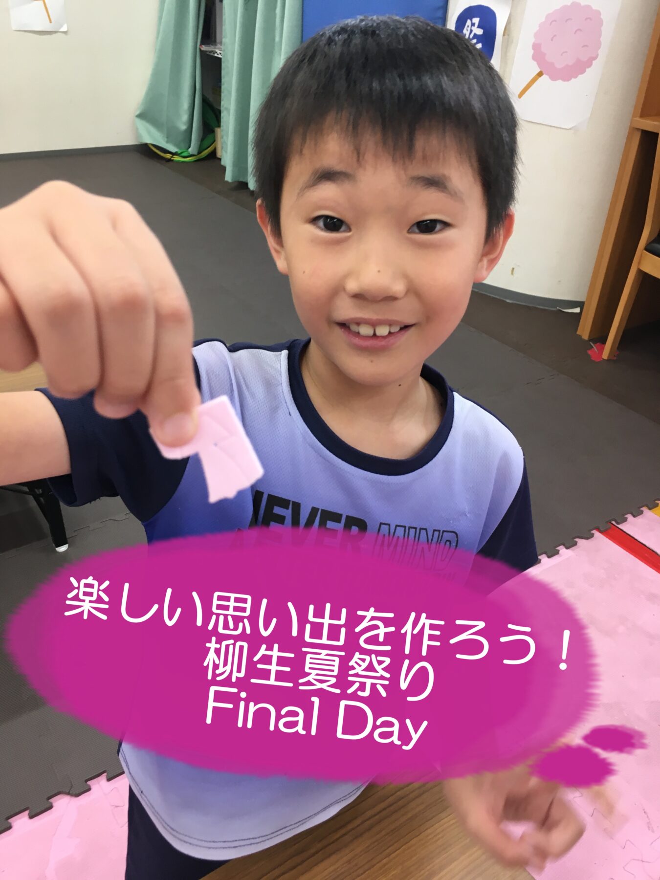 Smiling boy holds up a small pink craft piece toward the camera in a room with foam mats, with Final Day text overlaid.